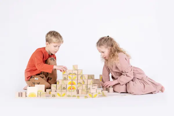 children playing with colorful blocks