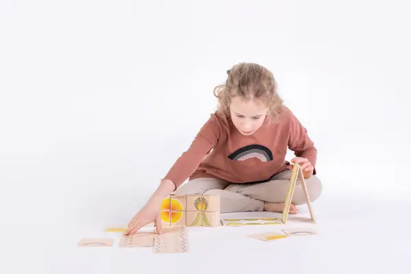 girl is quiet with Just Blocks Gaia wooden blocks