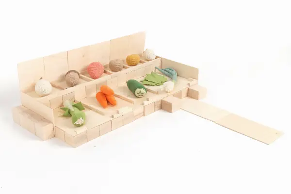 Construction of a vegetable store made of wooden blocks